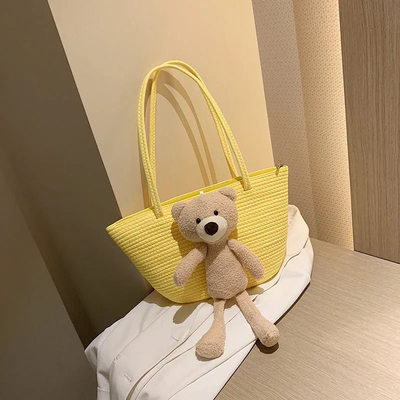 Cotton and linen woven shoulder bag with dumpling shape and double straps in multiple colours