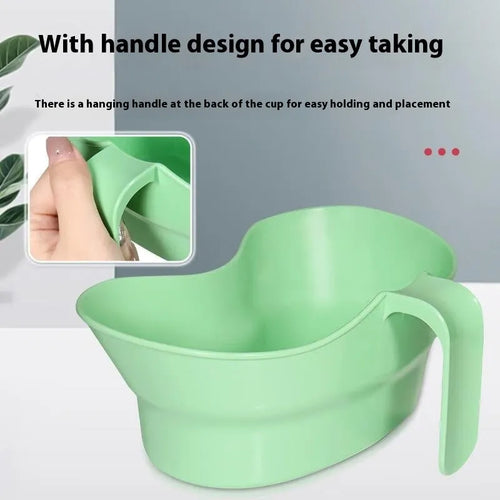 Green plastic nursing gargle cup with angled spout for bedridden patient mouthwash routines