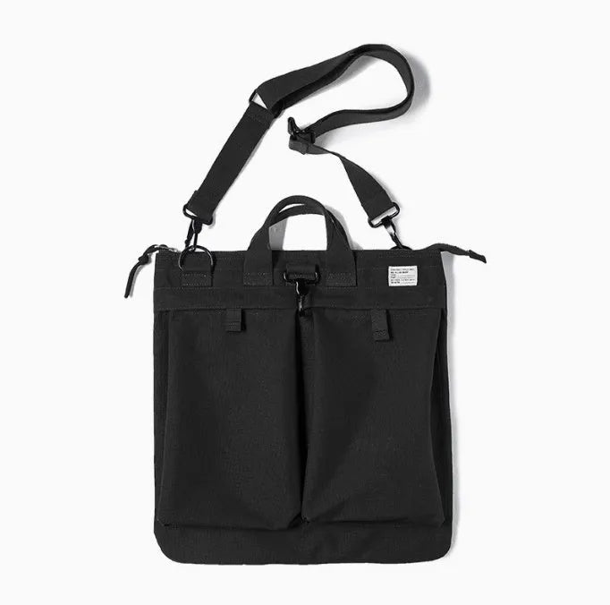 Canvas crossbody shoulder bag in military green with phone pocket and space for 15-inch laptop