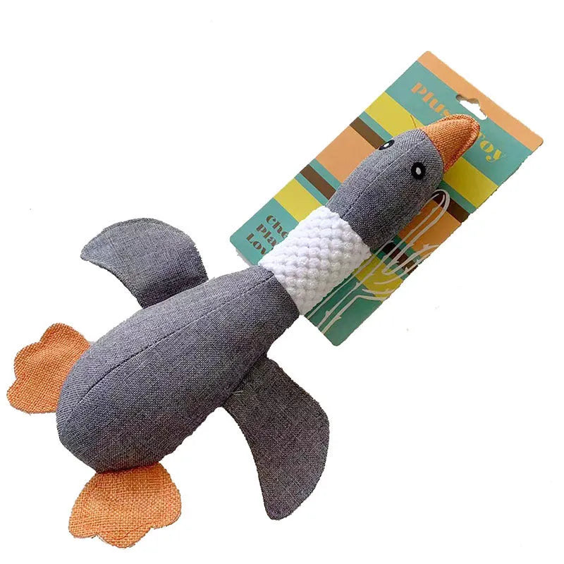 Blue, green, and grey duck-shaped durable dog plush toy with squeaker for chewing and play