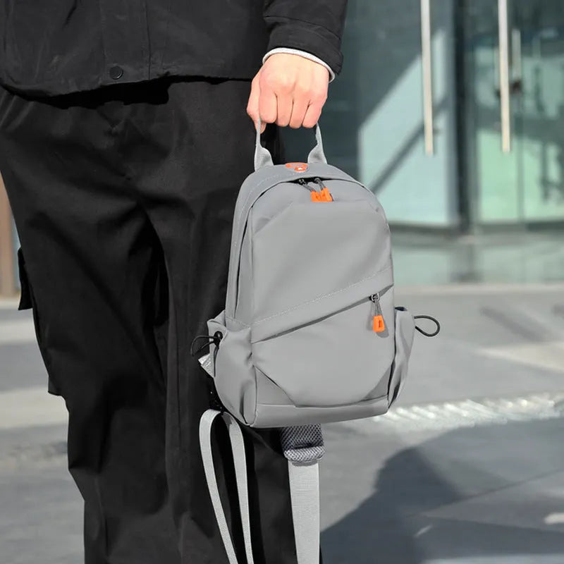 Men's black casual crossbody bag with a single shoulder strap made from polyester.