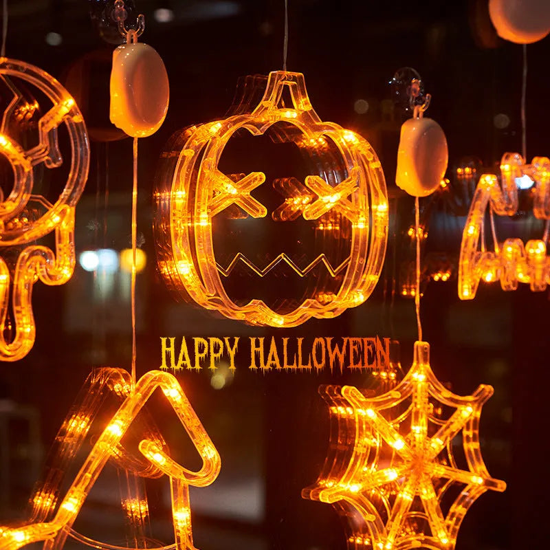 Seven Halloween LED lights with suction cups featuring spider, pumpkin and ghost designs for window decoration
