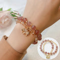 Women's retro bracelet in colour hair crystal or strawberry quartz with ethnic design elements