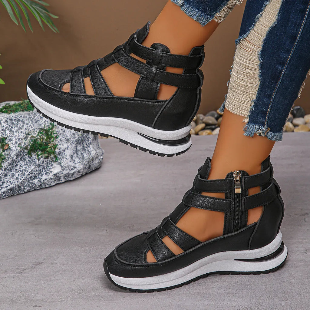 Women's black close-toed platform sandals with Velcro strap and hollow-out design.