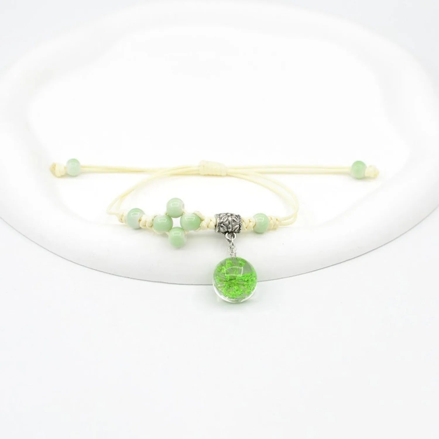 Glass dried flower bracelet with large 1.4 cm beads containing real preserved flowers in hand-woven lace design