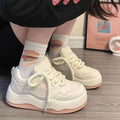Women's green platform sneakers with patent leather details and rubber sole