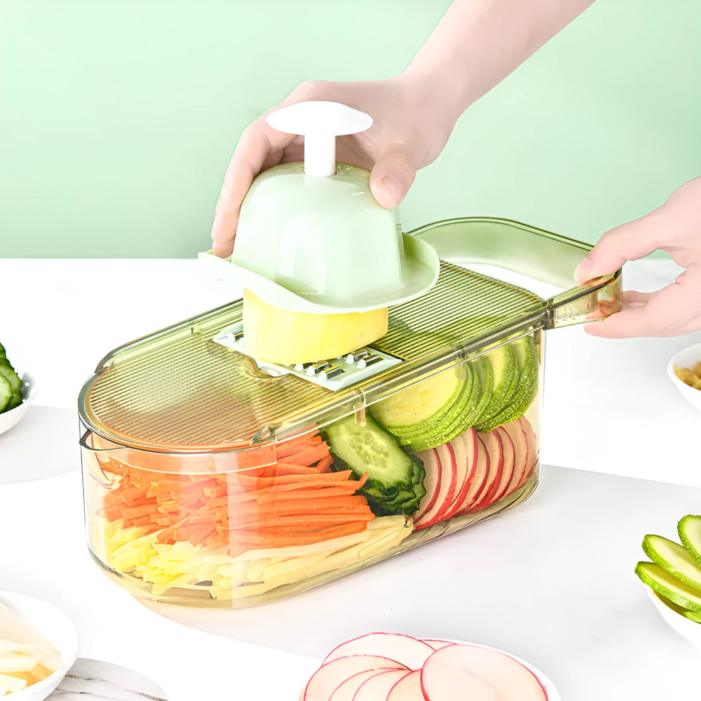 Transparent green vegetable cutter with stainless steel blades and 1.5L container