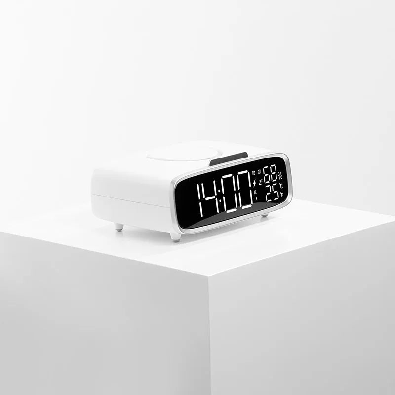White wireless charger Bluetooth speaker with night light function on wooden surface