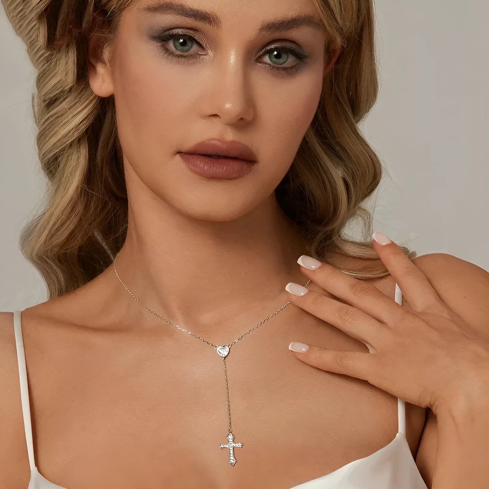 Silver love cross pendant necklace with V-neck chain on woman