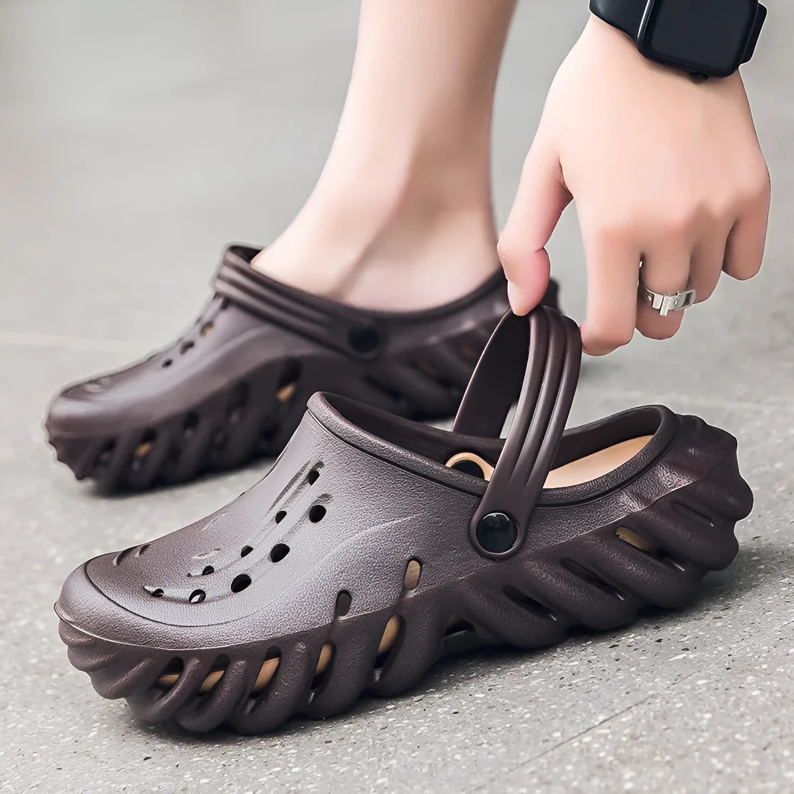 Men's beige hollow-out EVA slipper sandals with non-slip sole on a white background.