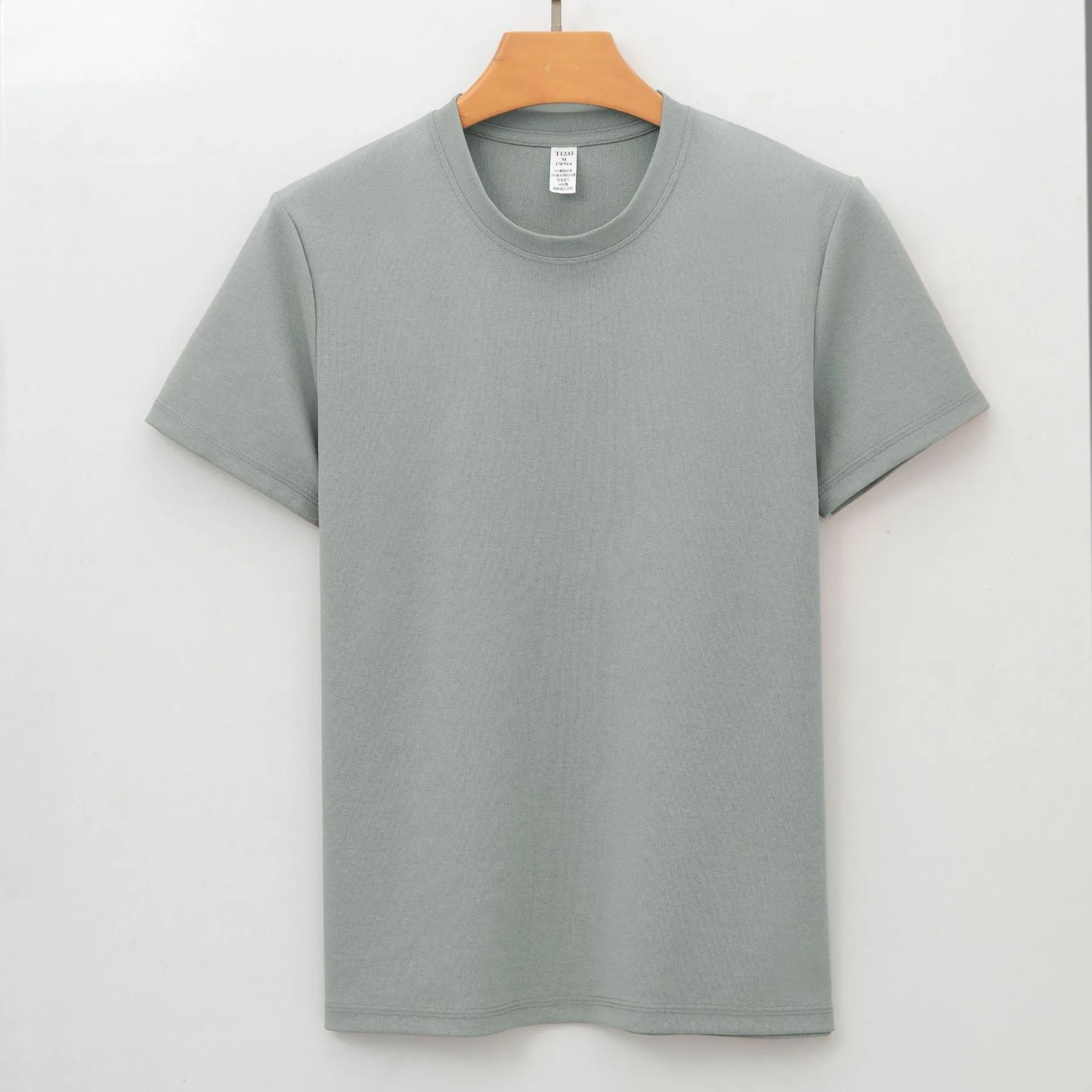 Men's solid colour quick-dry antibacterial short sleeve t-shirt on a hanger.