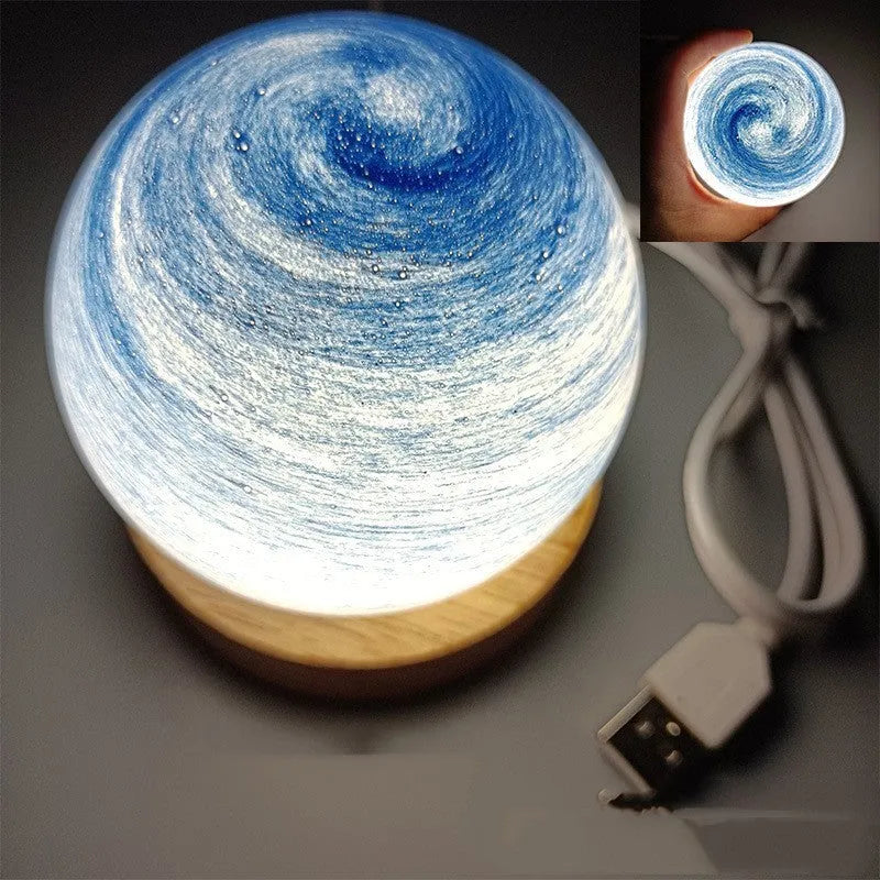 Planet-themed night light with USB cable and base, showing 80mm diameter globe