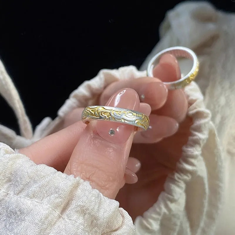 Geometric Xiangyun pattern open-mouth ring with silver and gold electroplated finish on white copper.