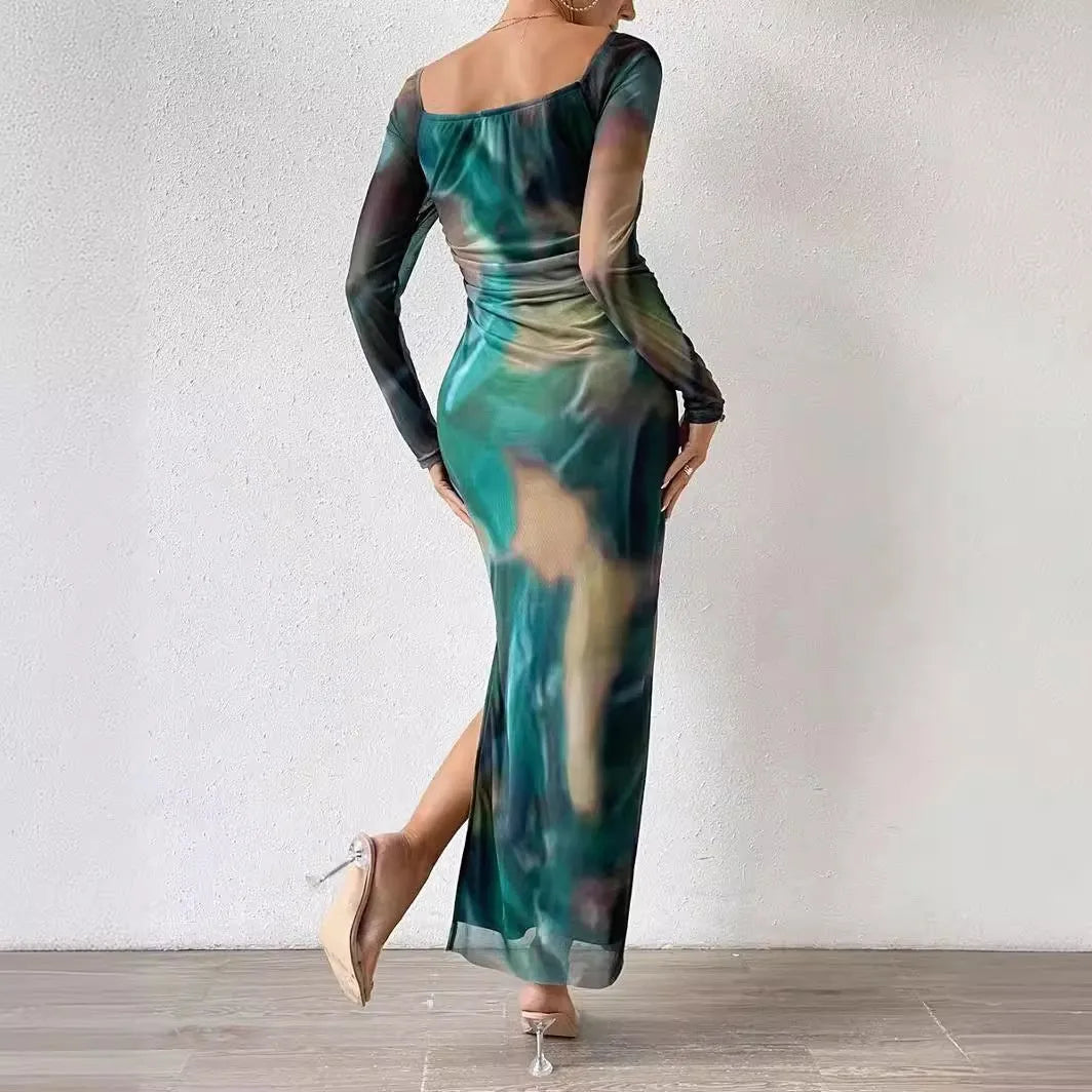Womens long printed mesh fishtail dress with gradient colour pleating and split skirt detail