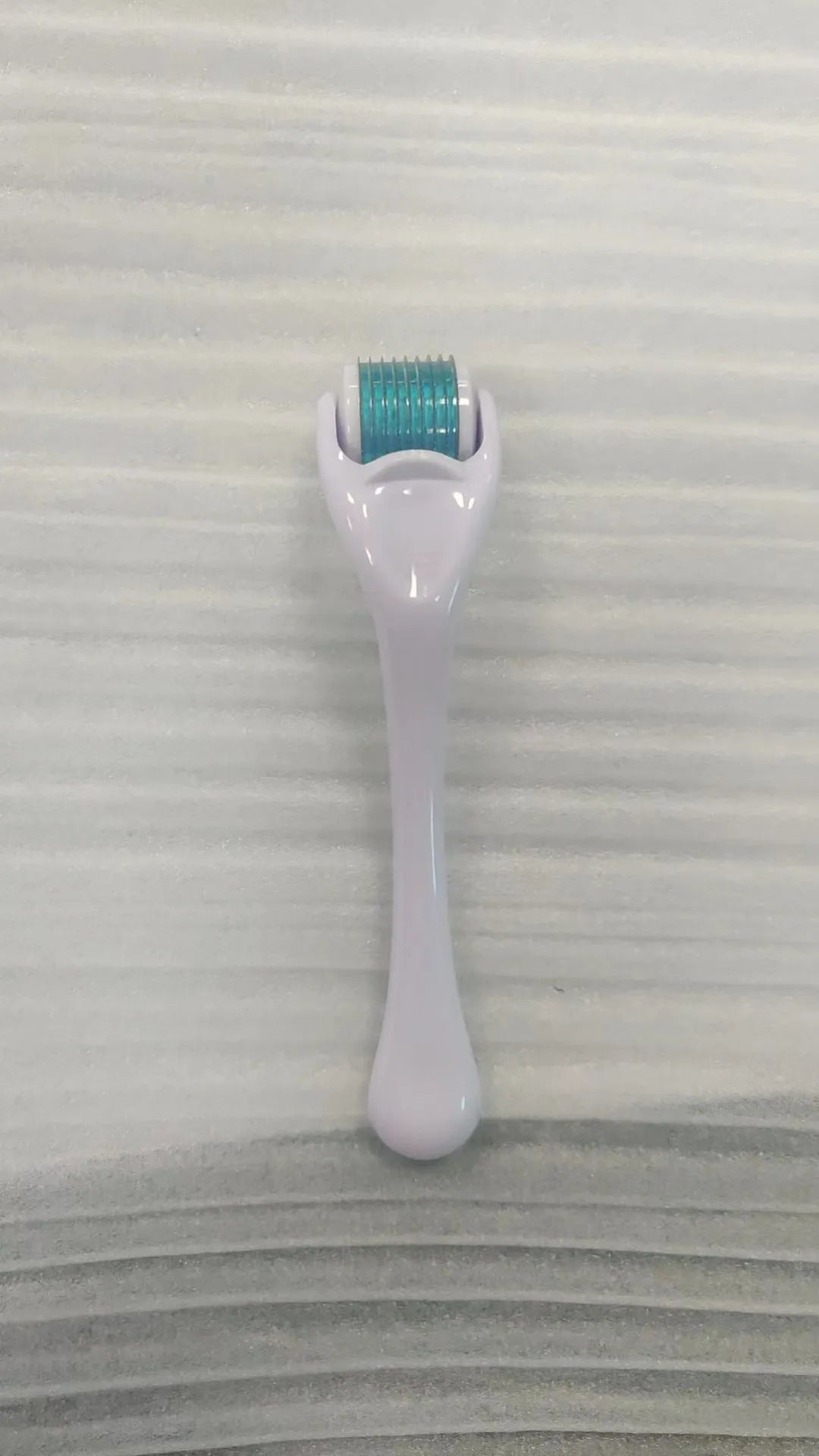 540 micro needle derma roller showing handle and wheel in different colour combinations with size specifications
