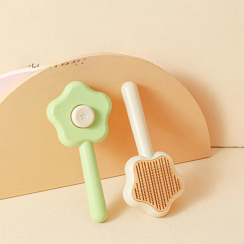 Self-cleaning stainless steel cat comb in green colour measuring 20cm long by 9.5cm wide