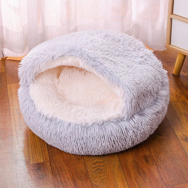 Semi-surrounded waterproof cloth dog kennel in a gradient colour, shown in a garden setting.