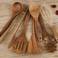 7-piece beechwood cooking utensil set including wooden spoon, spatula, ladle, and pasta fork on kitchen counter
