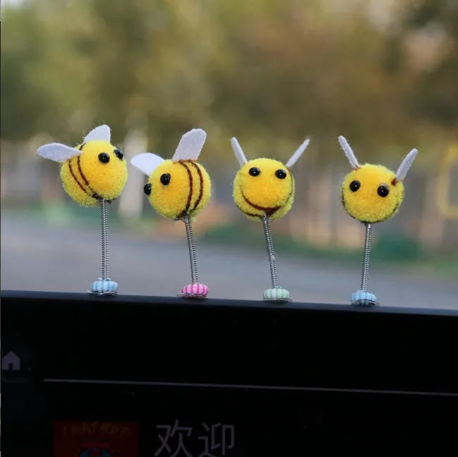 Swing spring bee car decoration made from a fur ball, measuring 3cm by 3cm.