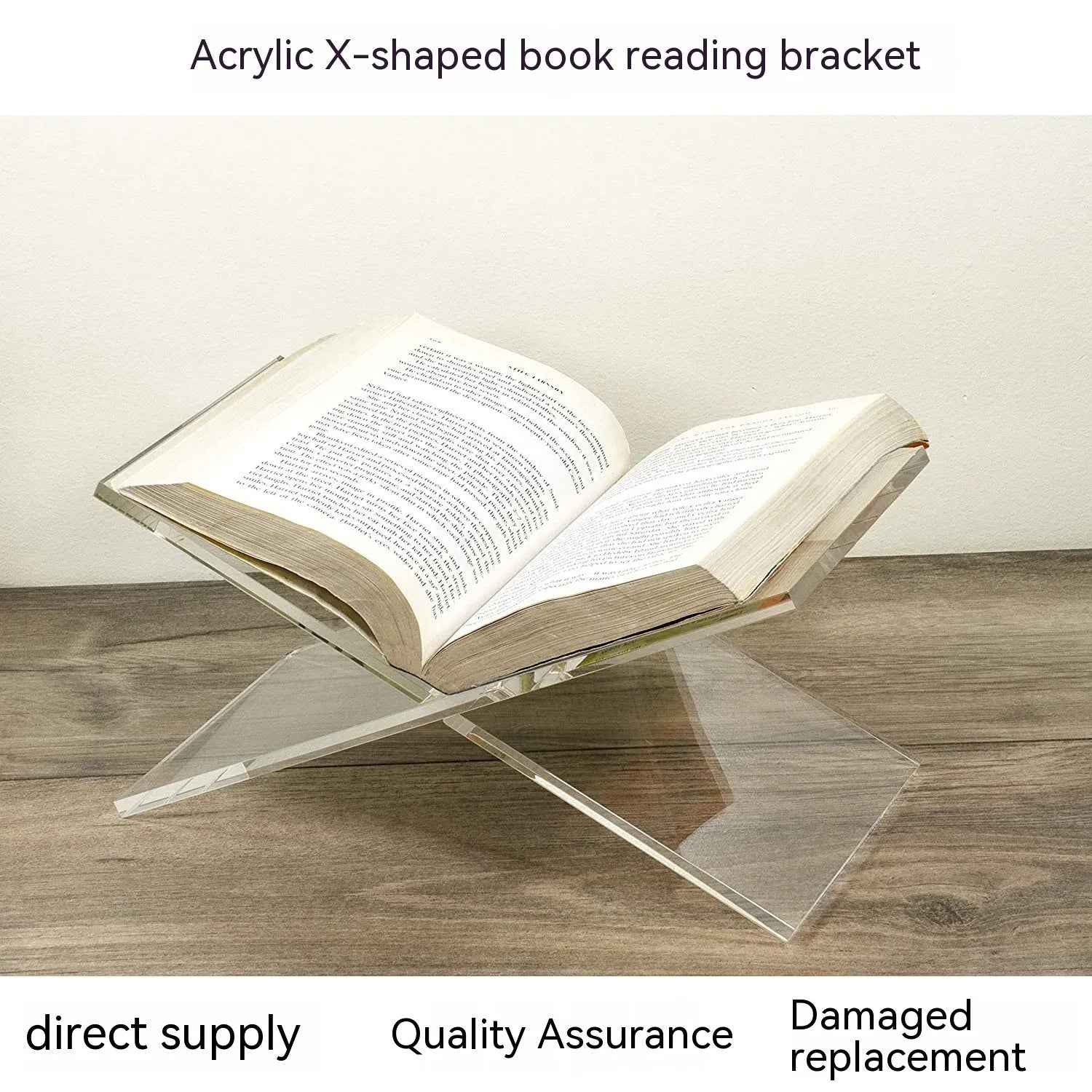 Clear acrylic X-shaped book reading rack holding books on a desk.