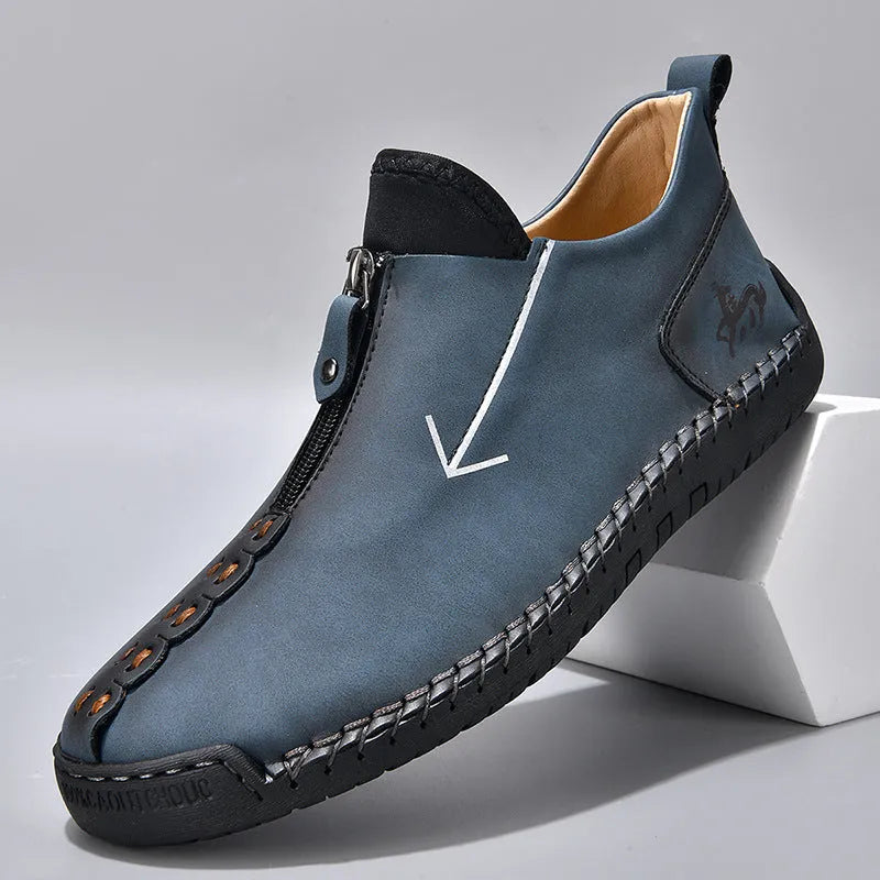 Men's black leather zip-up boots with hand-stitched detailing and round toe