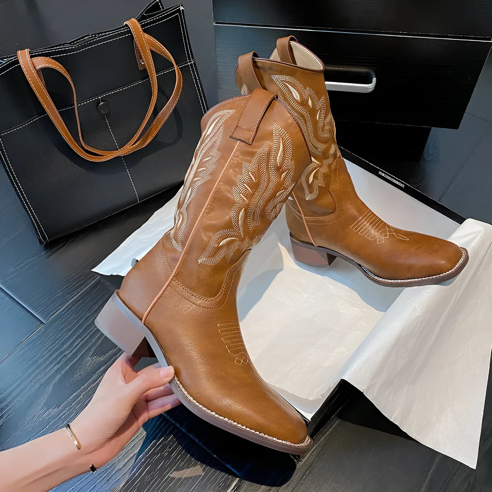 Brown women's mid-calf boots with embroidery detail, round toe, and low square heel.