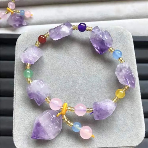 Natural shaped purple amethyst bead bracelet with a fu character charm for women.