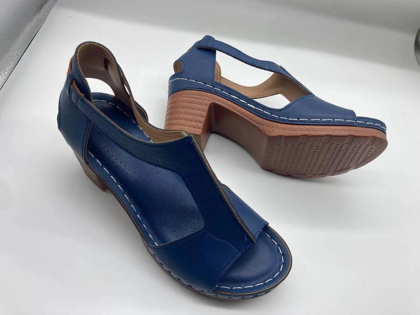 Women's white peep toe wedge sandals with Roman style buckle and low heel