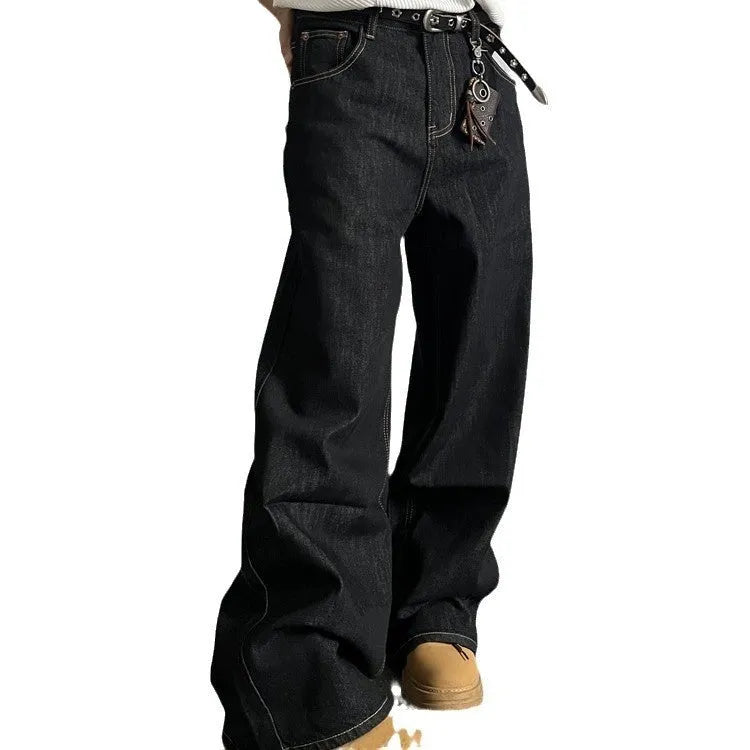 A pair of black loose wide-leg jeans with a straight-leg cut and zip fly on a mannequin.