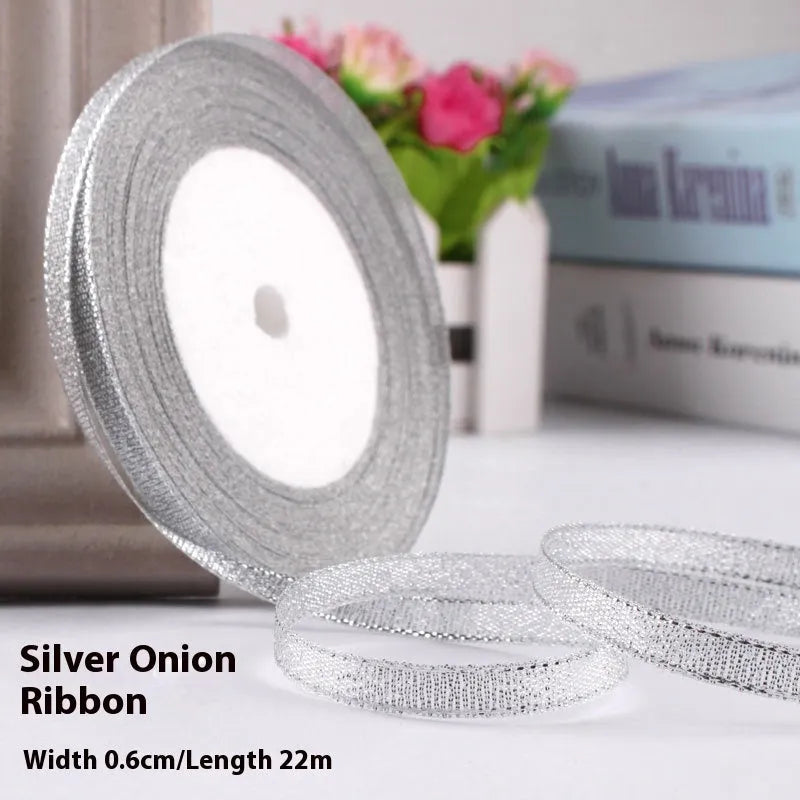 Roll of narrow 0.6cm wide polyester gift wrapping ribbon in assorted colours, showing 22 metre length.