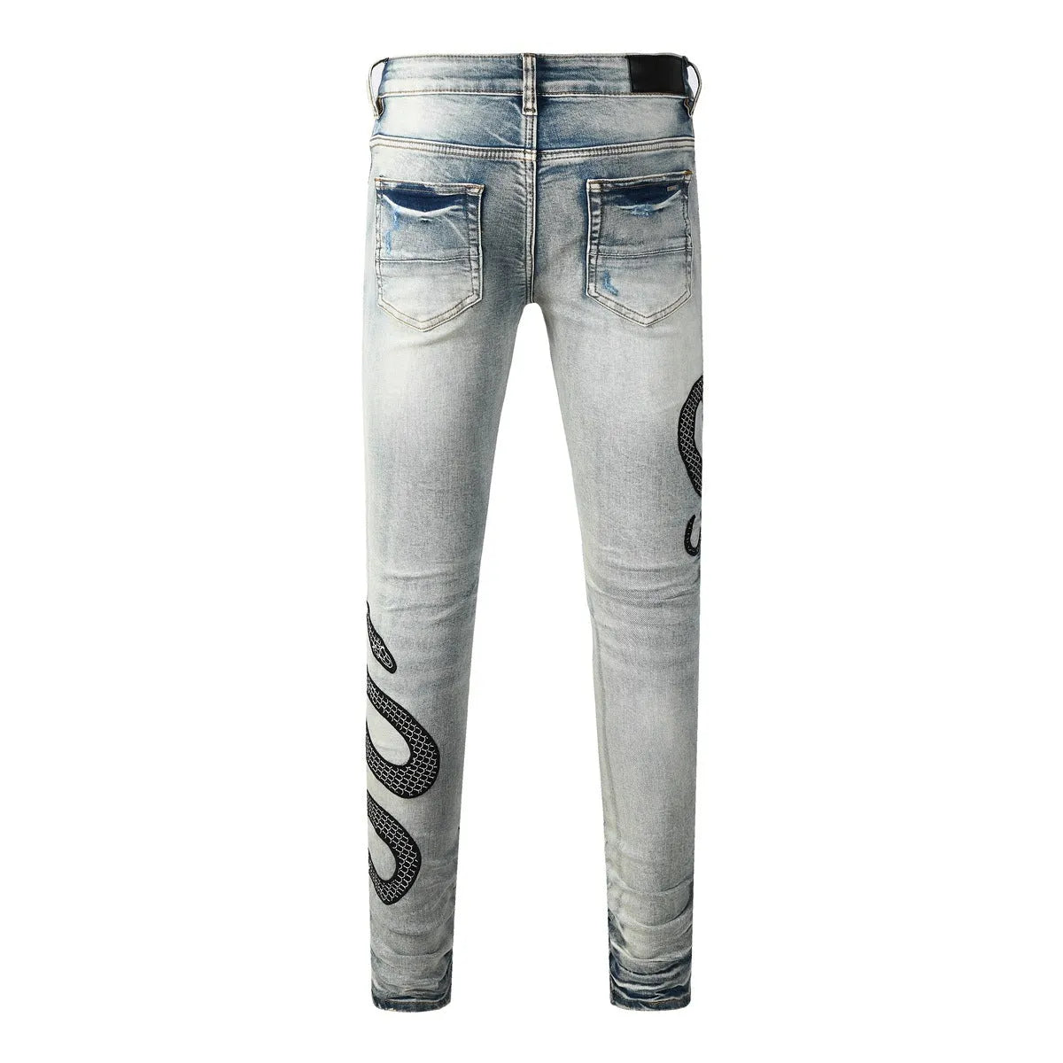Blue distressed skinny jeans with a mid-waist and button-fly opening on a neutral background.