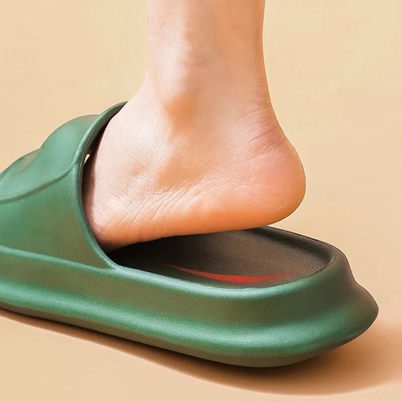 Pair of thick-soled white EVA foam flip-flop slippers on a bathroom floor, showing non-slip tread pattern.