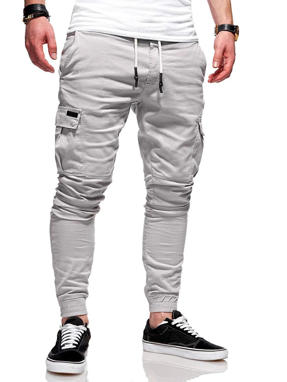 Men's loose polyester trousers with patch pockets and elastic waistband in light blue colour