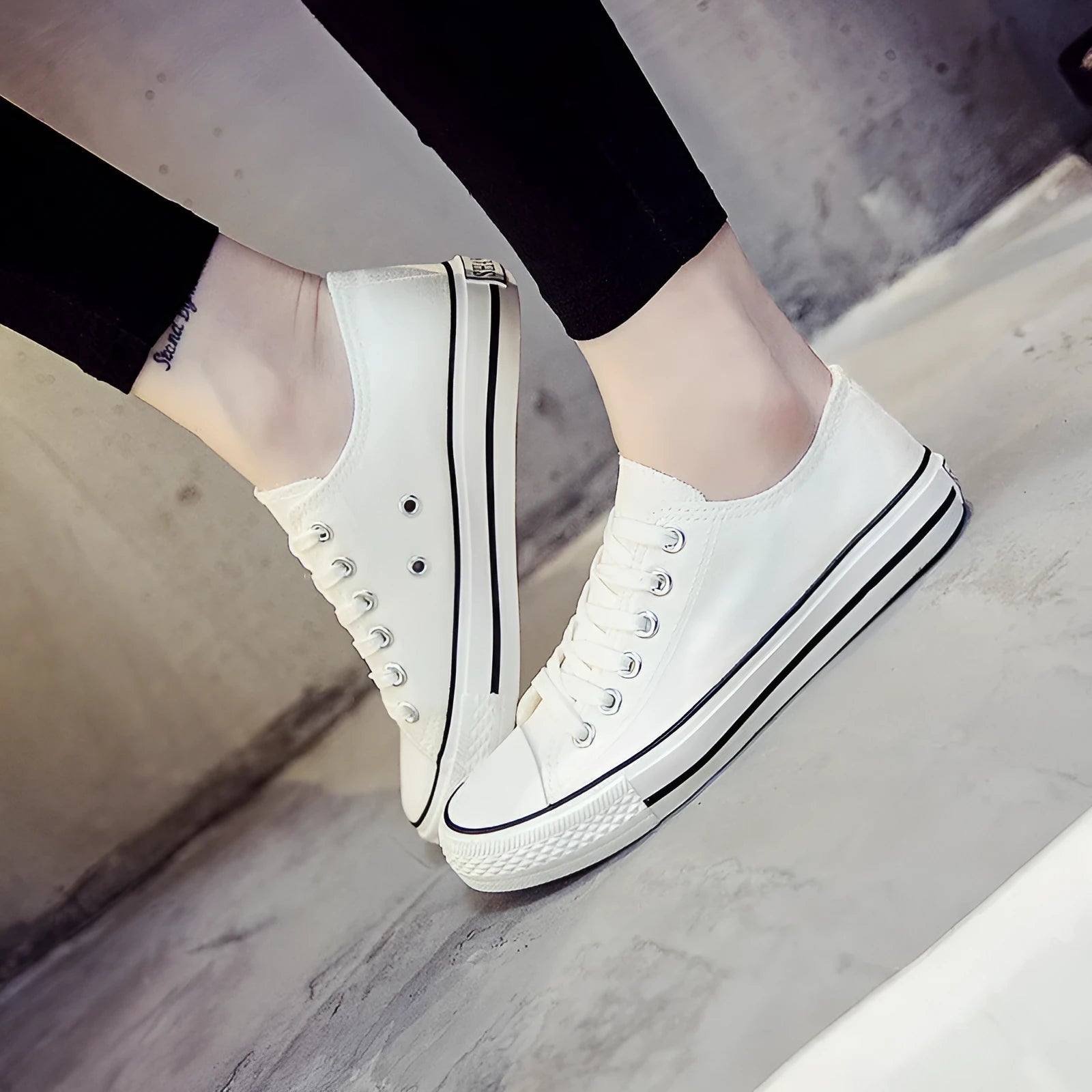 Women's solid colour canvas slip-on shoes in black, white, and red variations on a plain background.