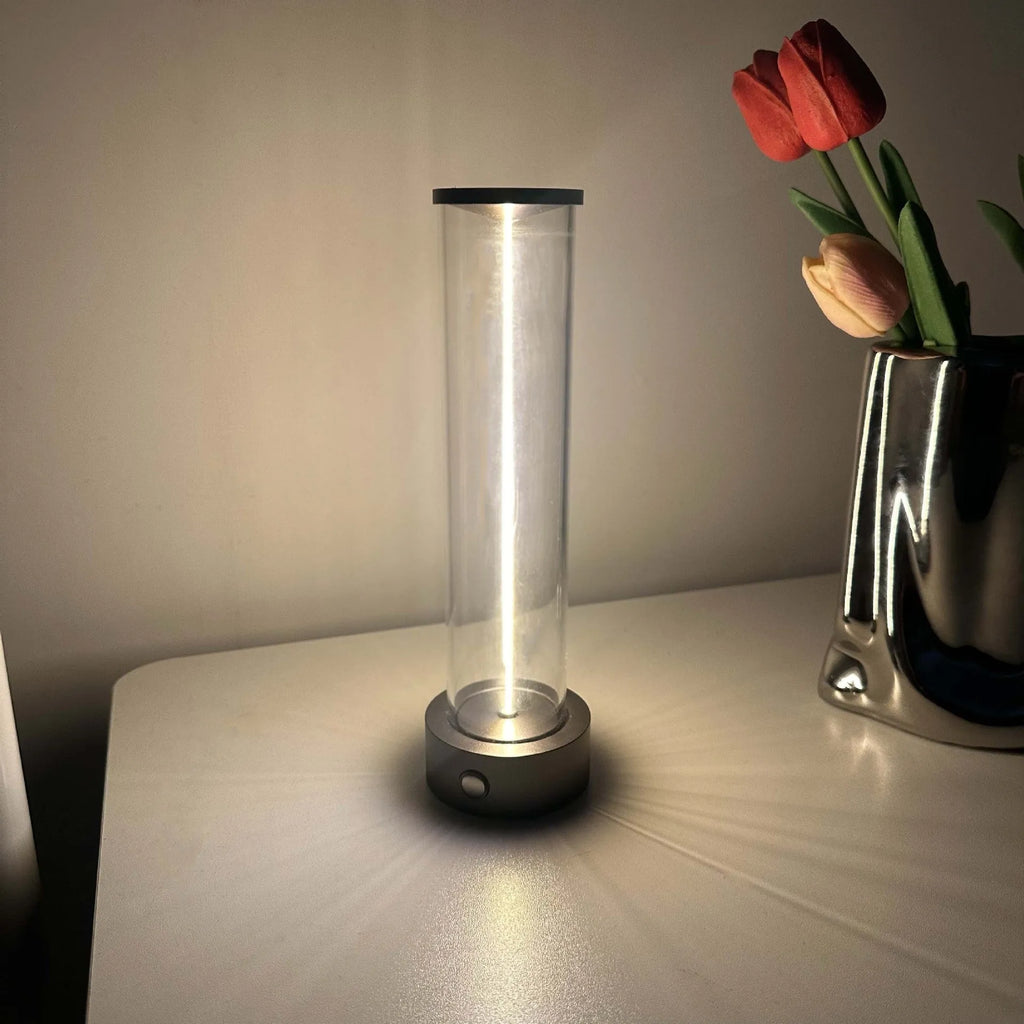Grey modern LED line glass light strip with magnetic suction base for USB charging.