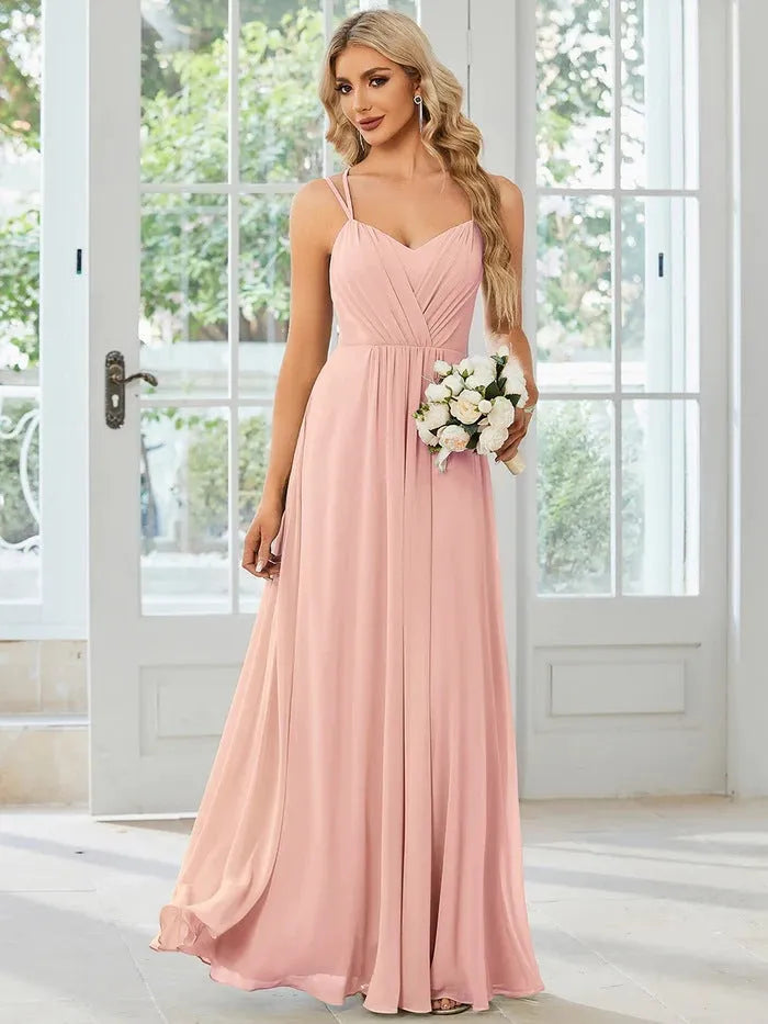 Women's long sleeveless A-line pleated dress in light green for banquet or casual wear.