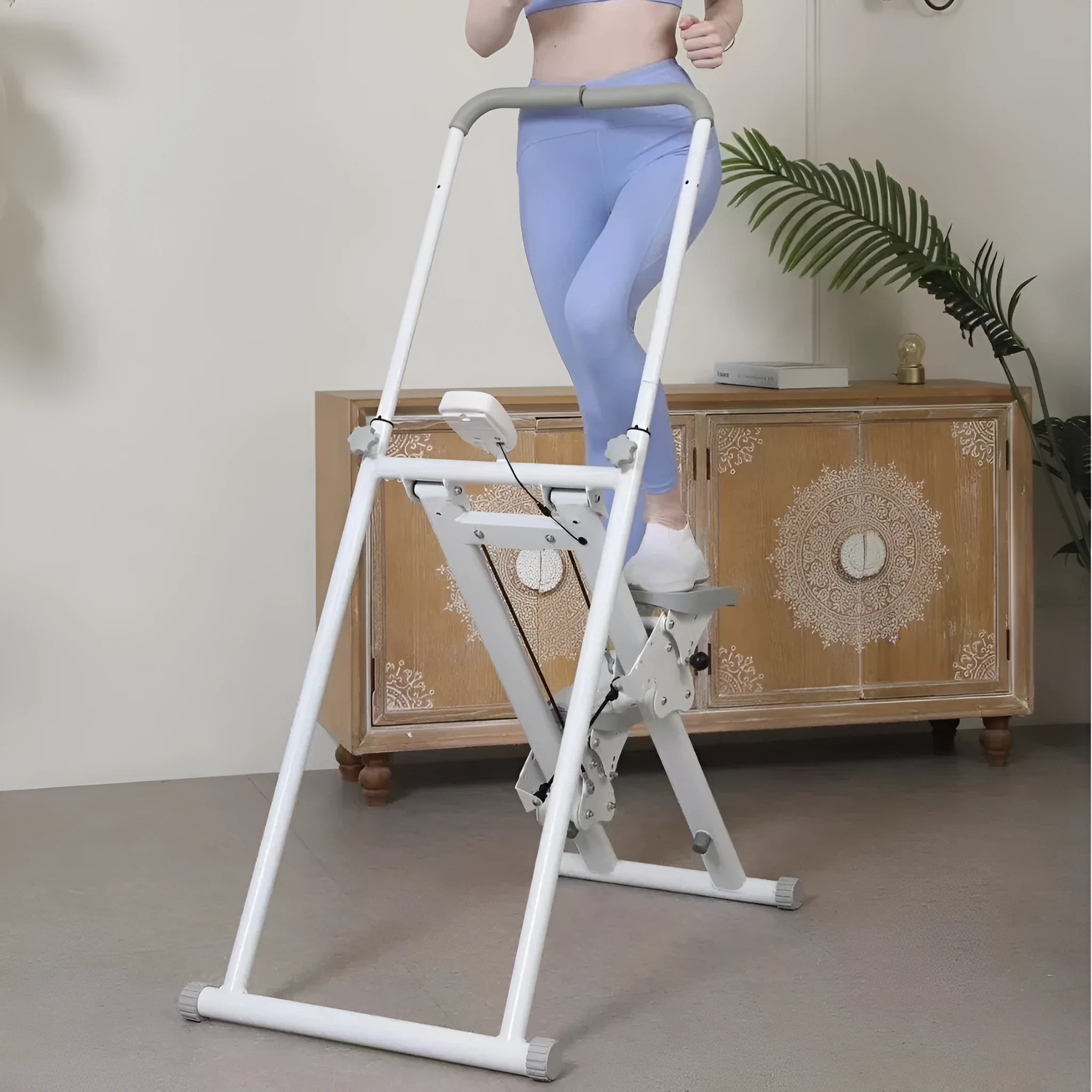 White folding home treadmill with a 1 horsepower motor shown in a domestic setting.
