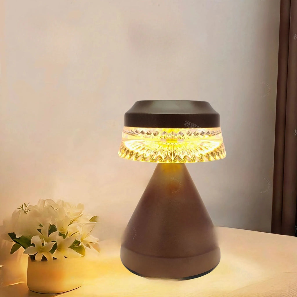 Small luxury style LED night lamp in orange with USB cable for charging.