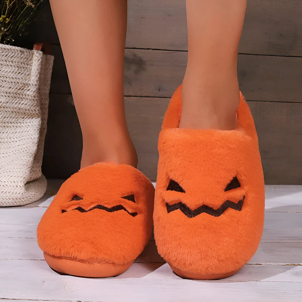 Orange Halloween pumpkin slippers with coral velvet upper and plush lining on non-slip PVC soles