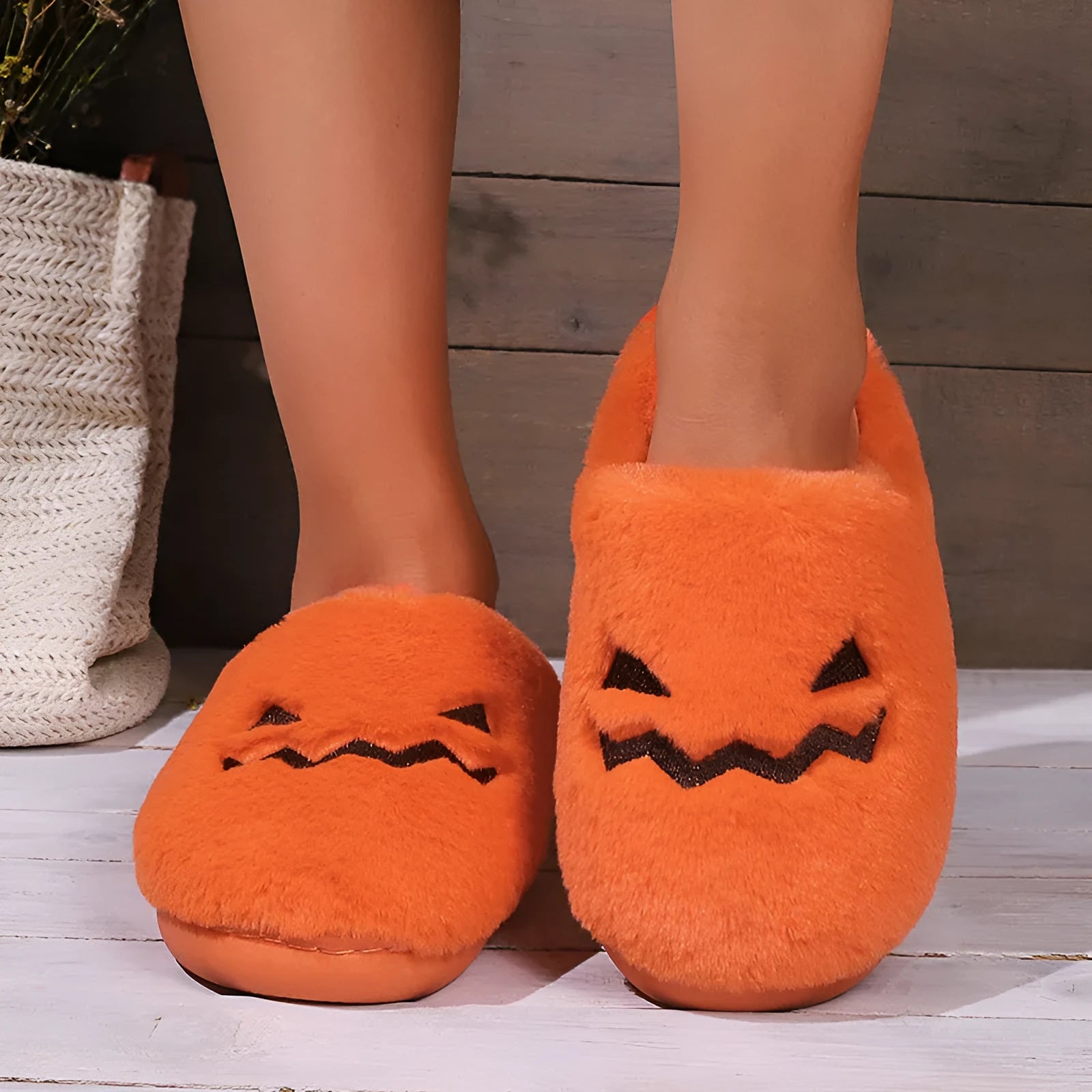 Orange Halloween pumpkin slippers with coral velvet upper and plush lining on non-slip PVC soles