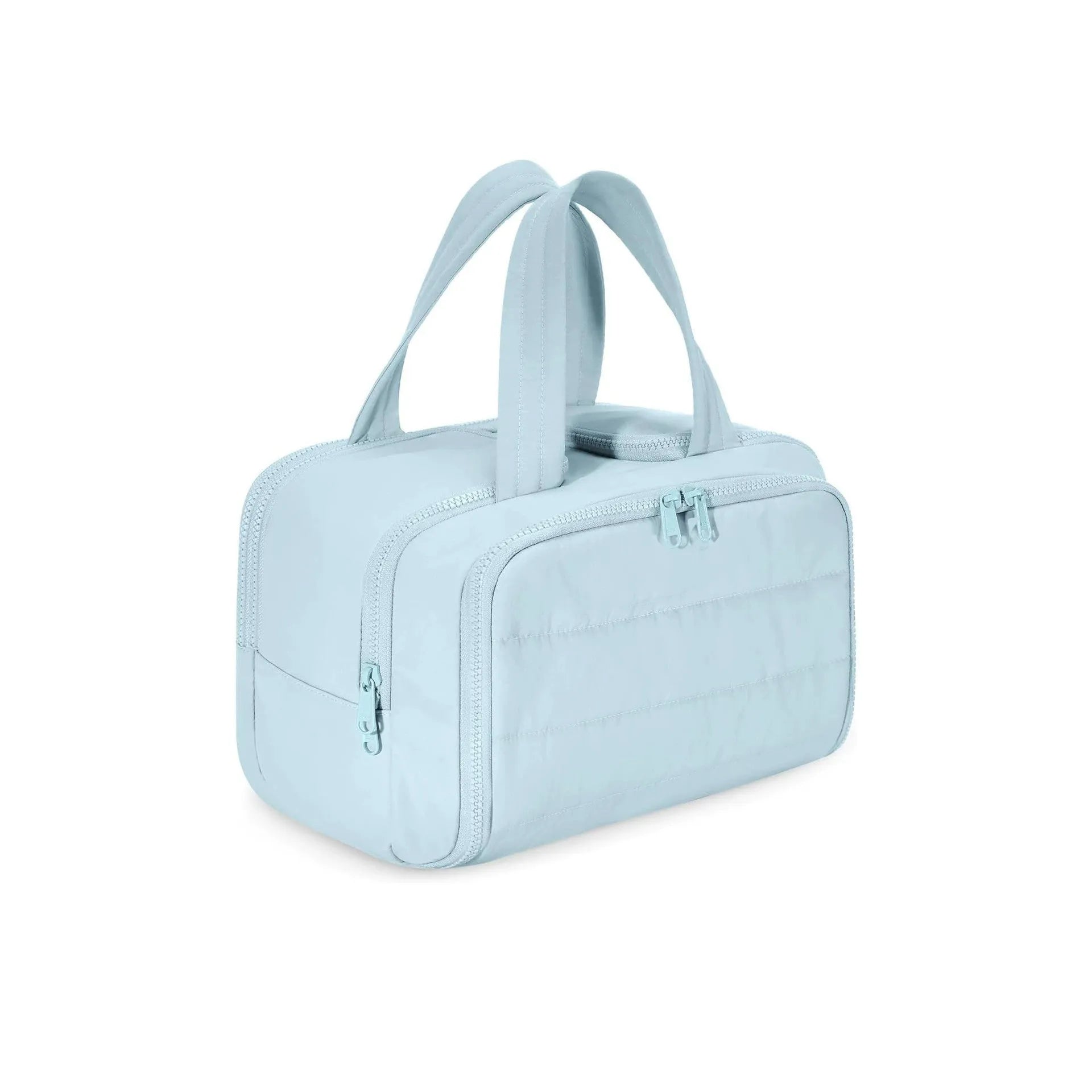 Large lightweight travel toiletry bag in beige with wide open design showing fluffy interior