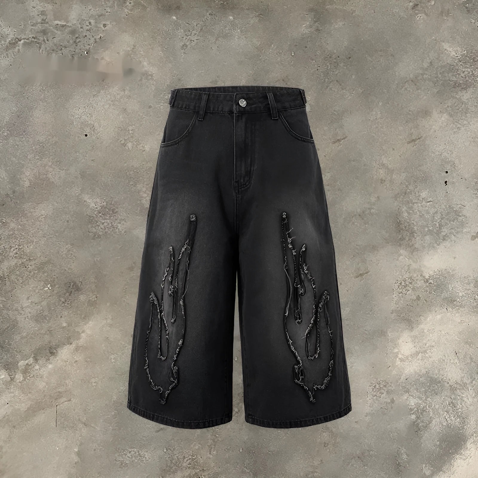 Men's black denim shorts with flame embroidery patch detail, cropped length and straight leg street style