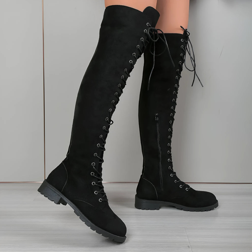 Black lace-up over-the-knee flat heel boots with round toe and leather stitching detail on artificial PU upper.