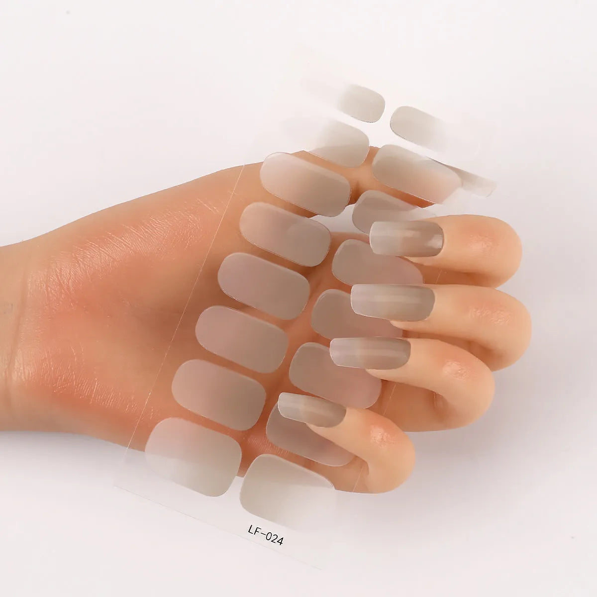 Set of 16 solid colour nail art stickers showing floral, geometric, and pattern designs for manicure application