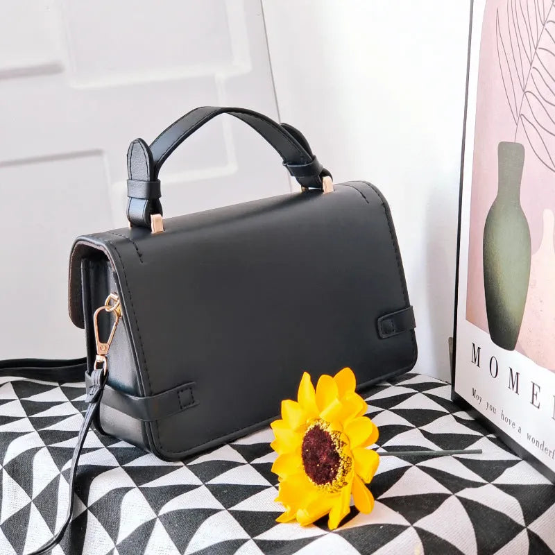 Retro square crossbody bag with ethnic floral stitch patterns and horizontal suitcase shape