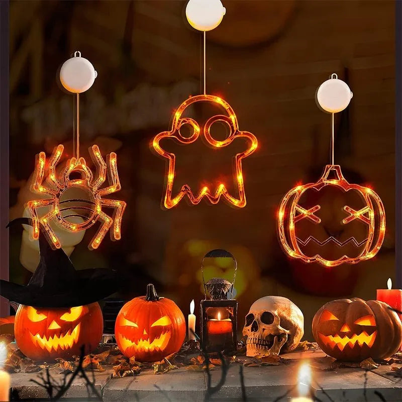 Seven Halloween LED lights with suction cups featuring spider, pumpkin and ghost designs for window decoration
