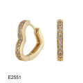 Gold plated brass heart-shaped ear clip earrings with zircon detail on a white background.