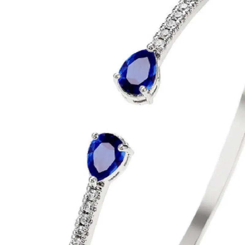 Copper bracelet with zircon inlay in white or blue colour simple design