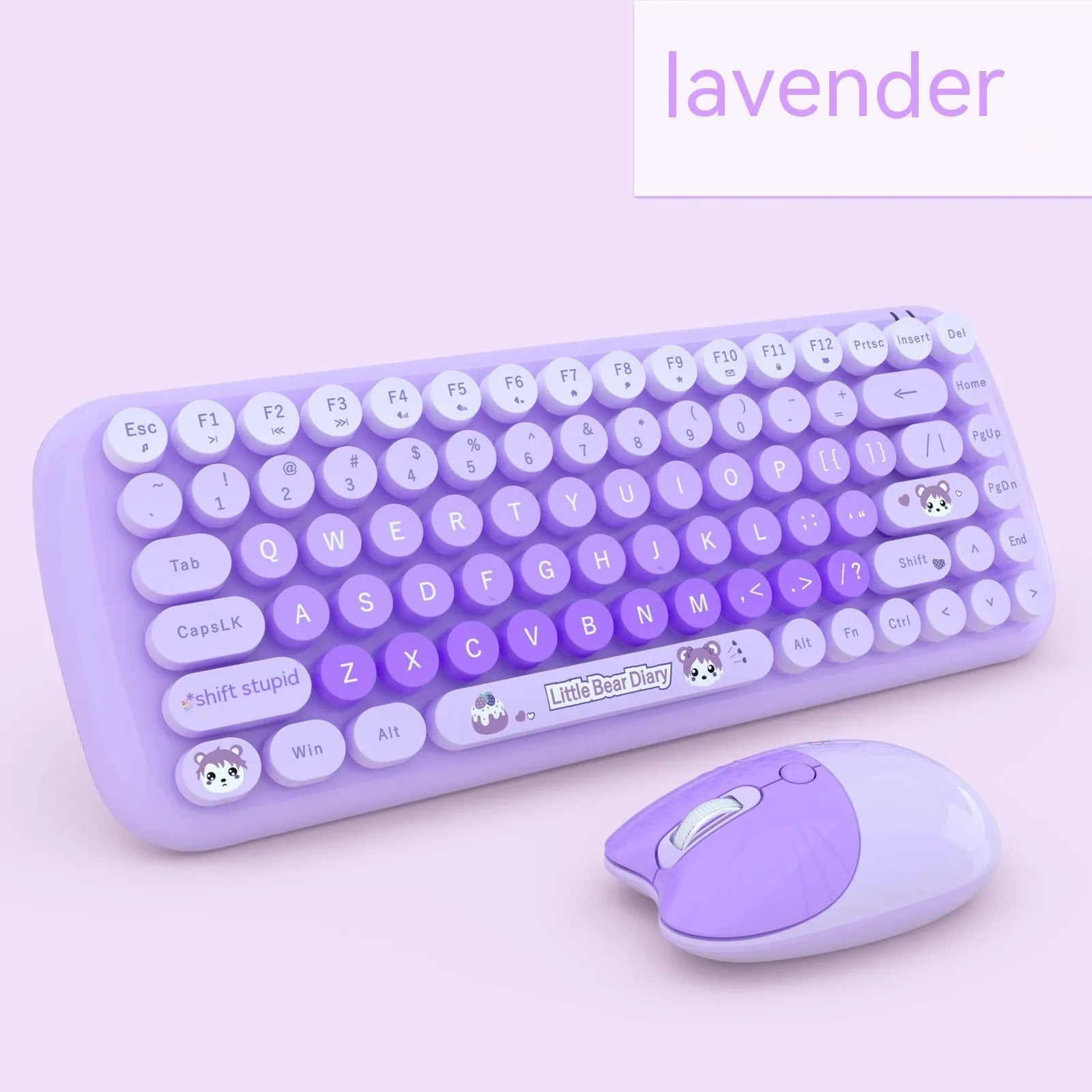 Candy pink wireless keyboard and mouse set on a desk next to a notebook computer.