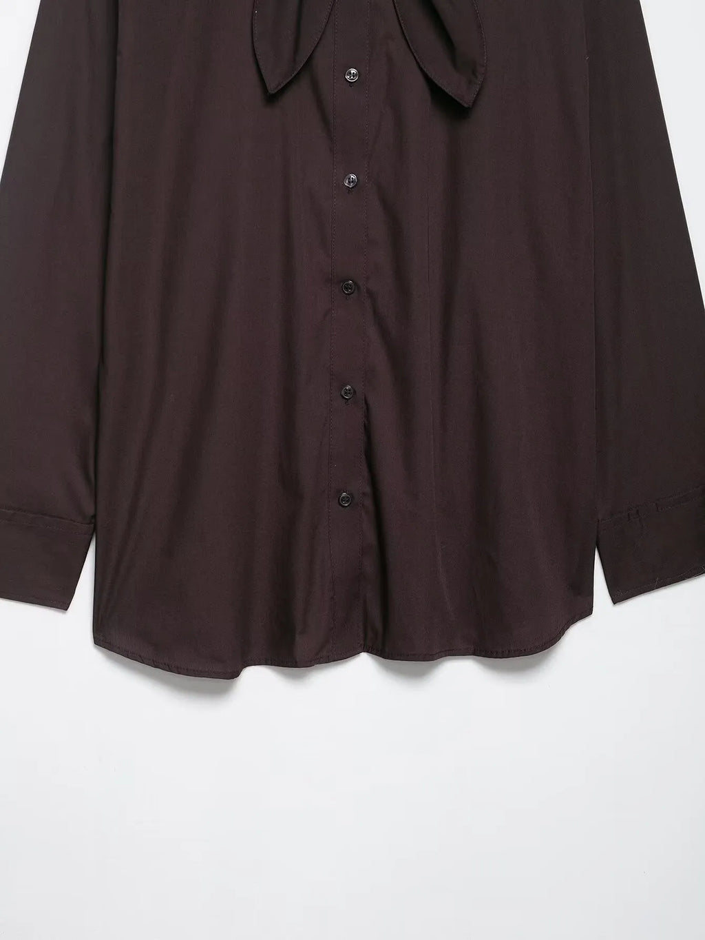 Brown women's loose-fit poplin shirt with long sleeves, cardigan style, and a bow tie detail.